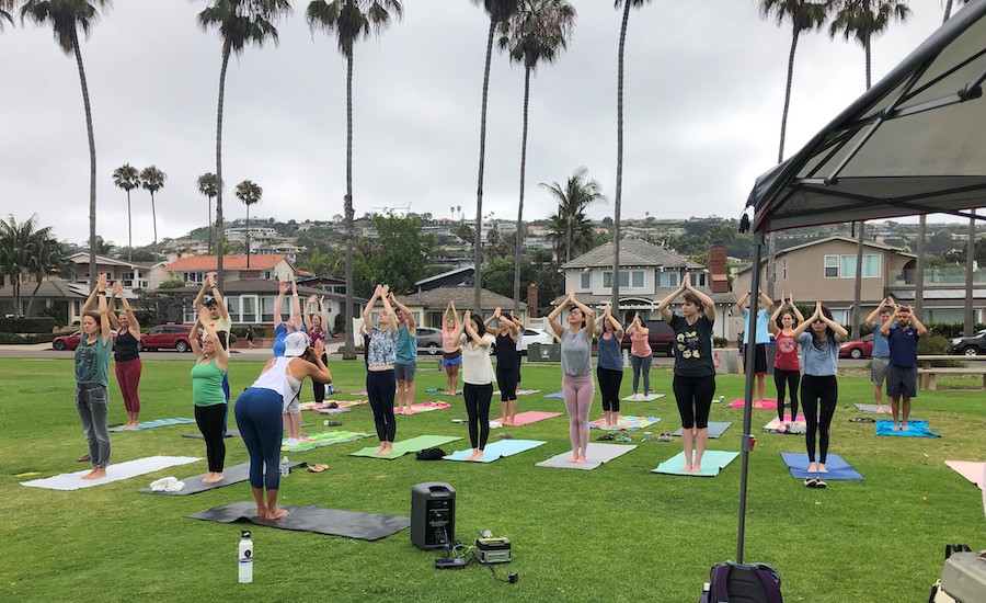 6 of 8, group doing yoga at La Jolla Shores