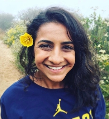 Sahana with a yellow flower in her hair