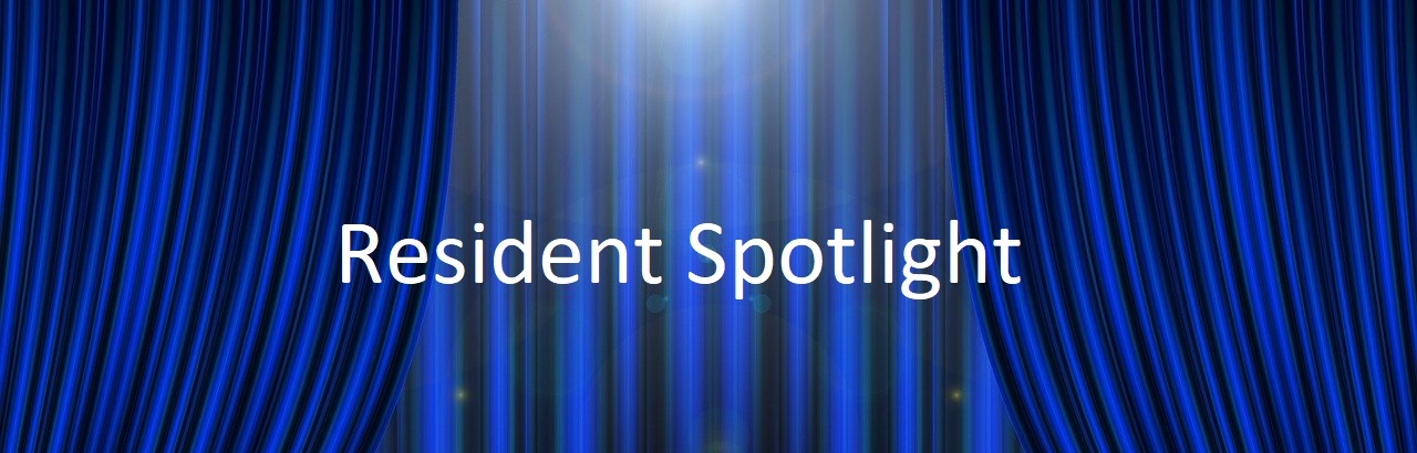 'Resident Spotlight' text on background of dark blue curtains