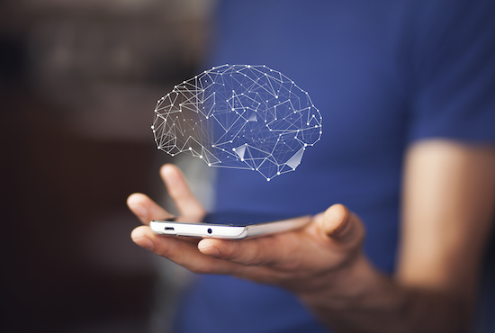 hand holding iPhone out, screen up, with geometric graphic of brain floating above
