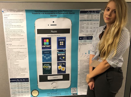 2019 NAN Conference - Tess standing next to poster